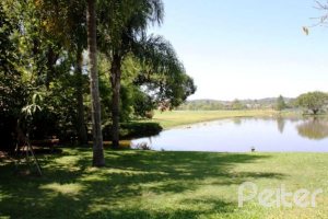 Casa em Condomínio à venda com 450m², 6 dormitórios, 4 suítes, 2 vagas, no bairro Terra Ville em Porto Alegre