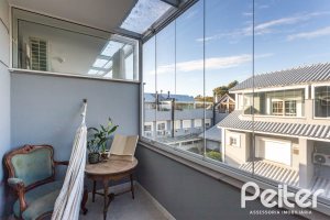 Casa em Condomínio à venda com 184m², 3 dormitórios, 1 suíte, 2 vagas, no bairro Vila Assunção em Porto Alegre