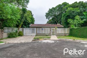 Casa em Condomínio à venda com 213m², 4 dormitórios, 3 suítes, 4 vagas, no bairro Vila Nova em Porto Alegre