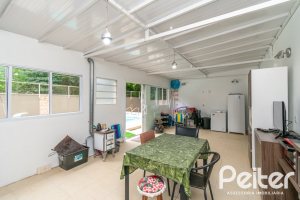 Casa em Condomínio à venda com 213m², 4 dormitórios, 3 suítes, 4 vagas, no bairro Vila Nova em Porto Alegre