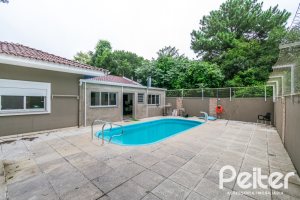 Casa em Condomínio à venda com 213m², 4 dormitórios, 3 suítes, 4 vagas, no bairro Vila Nova em Porto Alegre