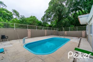 Casa em Condomínio à venda com 213m², 4 dormitórios, 3 suítes, 4 vagas, no bairro Vila Nova em Porto Alegre