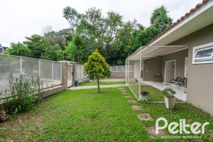 Casa em Condomínio à venda com 213m², 4 dormitórios, 3 suítes, 4 vagas, no bairro Vila Nova em Porto Alegre