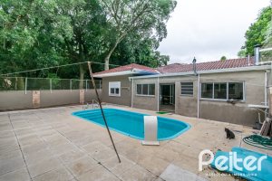 Casa em Condomínio à venda com 213m², 4 dormitórios, 3 suítes, 4 vagas, no bairro Vila Nova em Porto Alegre