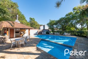 Casa em Condomínio à venda com 174m², 3 dormitórios, 1 suíte, 3 vagas, no bairro Tristeza em Porto Alegre