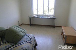 Casa em Condomínio à venda com 288m², 4 dormitórios, 2 suítes, 2 vagas, no bairro Knorr em Porto Alegre