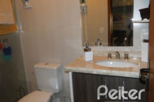 Casa em Condomínio à venda com 122m², 3 dormitórios, 1 suíte, 2 vagas, no bairro Cristal em Porto Alegre