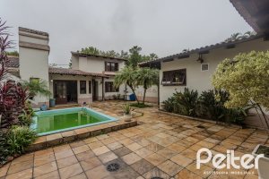 Casa à venda com 290m², 3 dormitórios, 1 suíte, 2 vagas, no bairro Ipanema em Porto Alegre