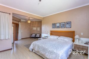 Casa em Condomínio à venda com 600m², 5 dormitórios, 5 suítes, 4 vagas, no bairro Cavalhada em Porto Alegre