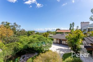 Casa em Condomínio à venda com 600m², 5 dormitórios, 5 suítes, 4 vagas, no bairro Cavalhada em Porto Alegre