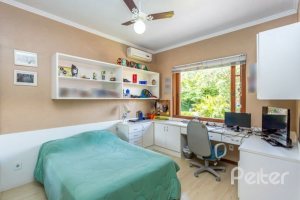 Casa em Condomínio à venda com 600m², 5 dormitórios, 5 suítes, 4 vagas, no bairro Cavalhada em Porto Alegre