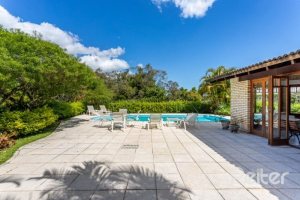 Casa em Condomínio à venda com 600m², 5 dormitórios, 5 suítes, 4 vagas, no bairro Cavalhada em Porto Alegre