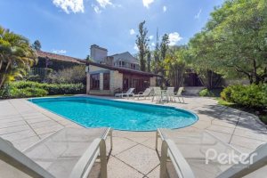 Casa em Condomínio à venda com 600m², 5 dormitórios, 5 suítes, 4 vagas, no bairro Cavalhada em Porto Alegre