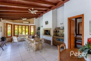 Casa em Condomínio à venda com 600m², 5 dormitórios, 5 suítes, 4 vagas, no bairro Cavalhada em Porto Alegre