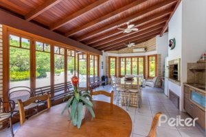 Casa em Condomínio à venda com 600m², 5 dormitórios, 5 suítes, 4 vagas, no bairro Cavalhada em Porto Alegre