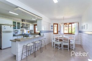 Casa em Condomínio à venda com 600m², 5 dormitórios, 5 suítes, 4 vagas, no bairro Cavalhada em Porto Alegre