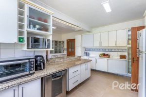 Casa em Condomínio à venda com 600m², 5 dormitórios, 5 suítes, 4 vagas, no bairro Cavalhada em Porto Alegre