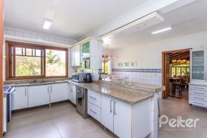 Casa em Condomínio à venda com 600m², 5 dormitórios, 5 suítes, 4 vagas, no bairro Cavalhada em Porto Alegre