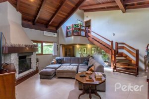 Casa em Condomínio à venda com 600m², 5 dormitórios, 5 suítes, 4 vagas, no bairro Cavalhada em Porto Alegre