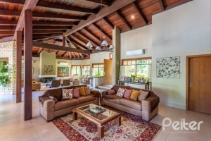 Casa em Condomínio à venda com 600m², 5 dormitórios, 5 suítes, 4 vagas, no bairro Cavalhada em Porto Alegre