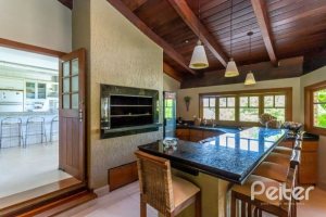 Casa em Condomínio à venda com 600m², 5 dormitórios, 5 suítes, 4 vagas, no bairro Cavalhada em Porto Alegre