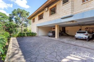 Casa em Condomínio à venda com 600m², 5 dormitórios, 5 suítes, 4 vagas, no bairro Cavalhada em Porto Alegre