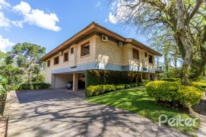 Casa em Condomínio à venda com 600m², 5 dormitórios, 5 suítes, 4 vagas, no bairro Cavalhada em Porto Alegre