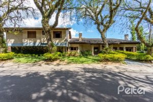 Casa em Condomínio à venda com 600m², 5 dormitórios, 5 suítes, 4 vagas, no bairro Cavalhada em Porto Alegre