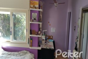 Casa à venda com 428m², 5 dormitórios, 4 suítes, 8 vagas, no bairro Vila Assunção em Porto Alegre