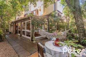 Casa em Condomínio à venda com 380m², 4 dormitórios, 2 suítes, 3 vagas, no bairro Tristeza em PORTO ALEGRE