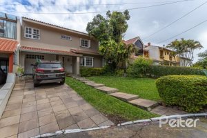 Casa em Condomínio à venda com 290m², 4 dormitórios, 2 suítes, 2 vagas, no bairro Ipanema em Porto Alegre