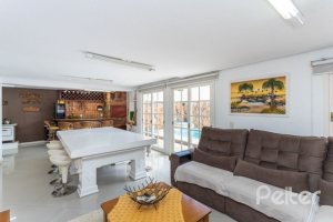 Casa em Condomínio à venda com 290m², 4 dormitórios, 2 suítes, 2 vagas, no bairro Ipanema em Porto Alegre