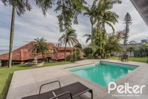 Casa à venda com 450m², 4 dormitórios, 3 suítes, 5 vagas, no bairro Vila Conceição em Porto Alegre