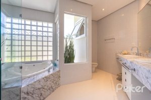 Casa em Condomínio à venda com 253m², 3 dormitórios, 1 suíte, 2 vagas, no bairro Terra Ville em PORTO ALEGRE