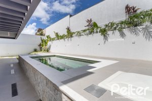 Casa em Condomínio à venda com 387m², 4 dormitórios, 4 suítes, 5 vagas, no bairro Alphaville em PORTO ALEGRE