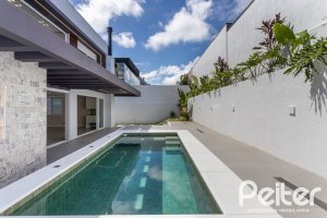Casa em Condomínio à venda com 387m², 4 dormitórios, 4 suítes, 5 vagas, no bairro Alphaville em PORTO ALEGRE