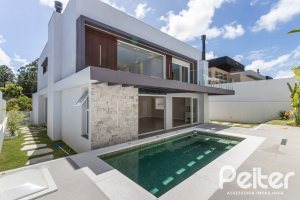 Casa em Condomínio à venda com 387m², 4 dormitórios, 4 suítes, 5 vagas, no bairro Alphaville em PORTO ALEGRE