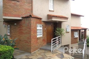 Casa em Condomínio à venda com 198m², 3 dormitórios, 1 suíte, 2 vagas, no bairro Tristeza em Porto Alegre