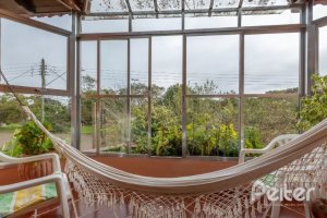 Casa à venda com 240m², 3 dormitórios, 2 suítes, 4 vagas, no bairro Guarujá em Porto Alegre
