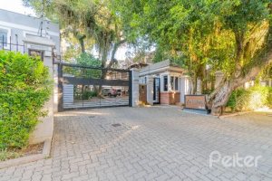 Casa em Condomínio à venda com 343m², 3 dormitórios, 3 suítes, 3 vagas, no bairro Tristeza em Porto Alegre