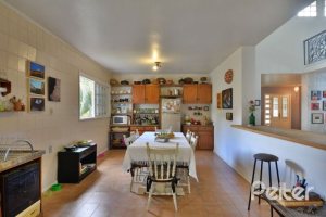 Casa à venda com 386m², 3 dormitórios, 1 suíte, 2 vagas, no bairro Tristeza em Porto Alegre