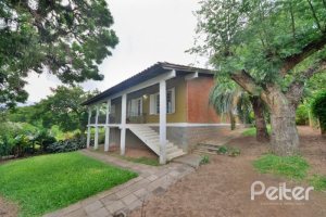 Casa à venda com 386m², 3 dormitórios, 1 suíte, 2 vagas, no bairro Tristeza em Porto Alegre