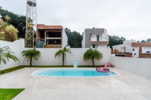 Casa em Condomínio à venda com 250m², 3 dormitórios, 3 suítes, 3 vagas, no bairro Hipica em PORTO ALEGRE
