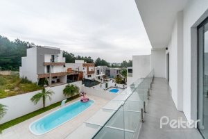 Casa em Condomínio à venda com 250m², 3 dormitórios, 3 suítes, 3 vagas, no bairro Hipica em PORTO ALEGRE