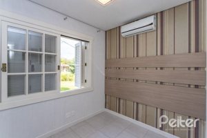 Casa em Condomínio à venda com 348m², 4 dormitórios, 2 suítes, 4 vagas, no bairro Terra Ville em PORTO ALEGRE