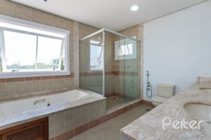 Casa em Condomínio à venda com 348m², 4 dormitórios, 2 suítes, 4 vagas, no bairro Terra Ville em PORTO ALEGRE