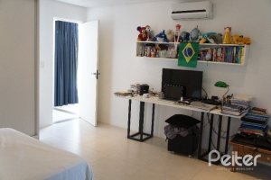 Casa em Condomínio à venda com 288m², 3 dormitórios, 3 suítes, 4 vagas, no bairro Terra Ville em PORTO ALEGRE