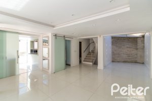 Casa em Condomínio à venda com 292m², 4 dormitórios, 2 suítes, 3 vagas, no bairro Vila Assunção em Porto Alegre