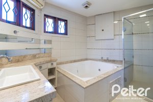 Casa em Condomínio à venda com 292m², 4 dormitórios, 2 suítes, 3 vagas, no bairro Vila Assunção em Porto Alegre