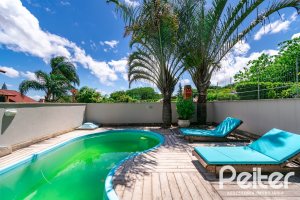 Casa à venda com 320m², 4 dormitórios, 2 suítes, 3 vagas, no bairro Jardim Isabel em Porto Alegre